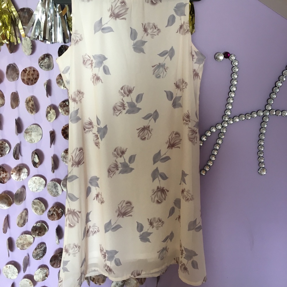 Sleeveless cream dress with purple flowers